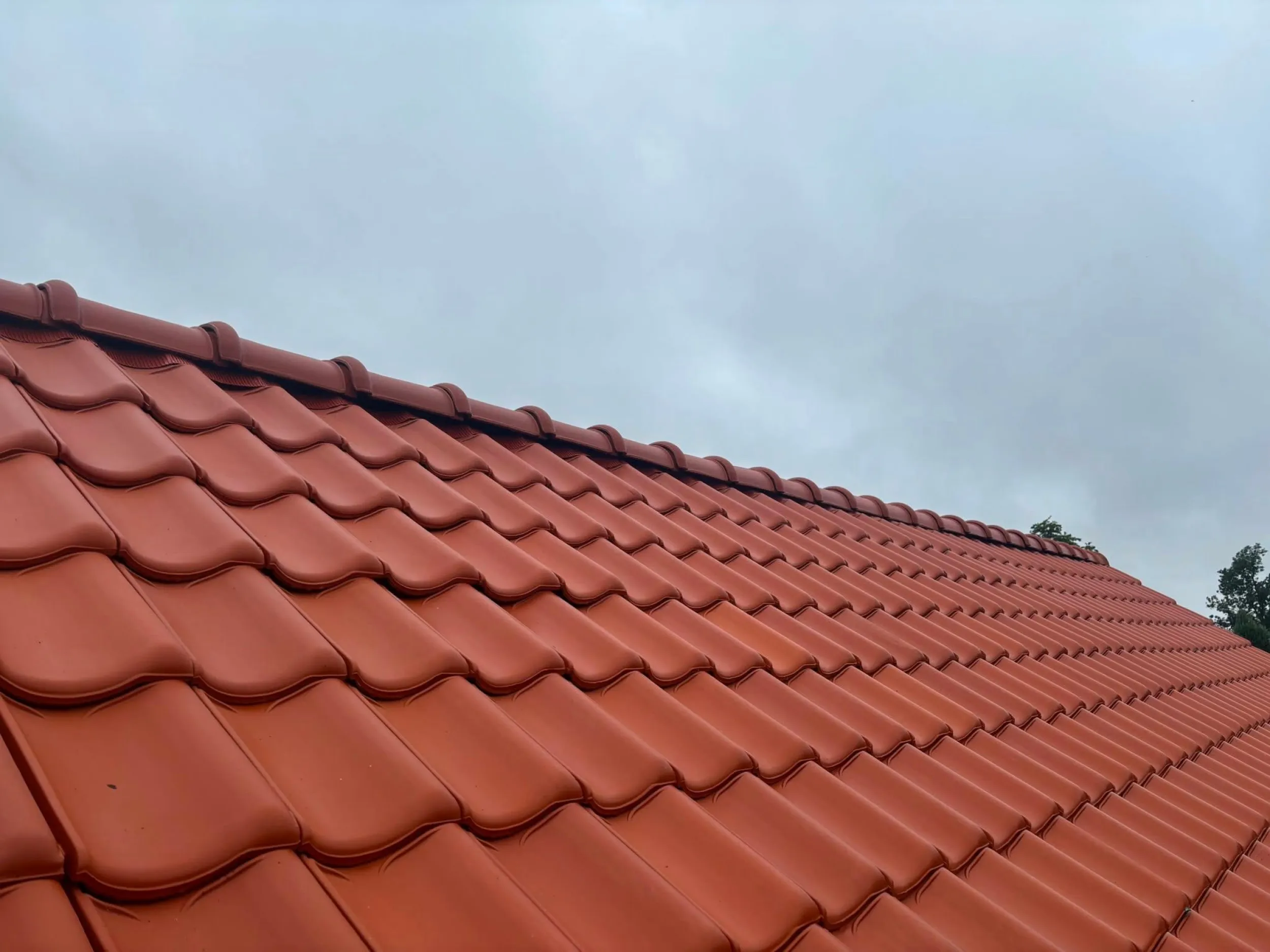Dakrenovatie rode pannen in Urmond