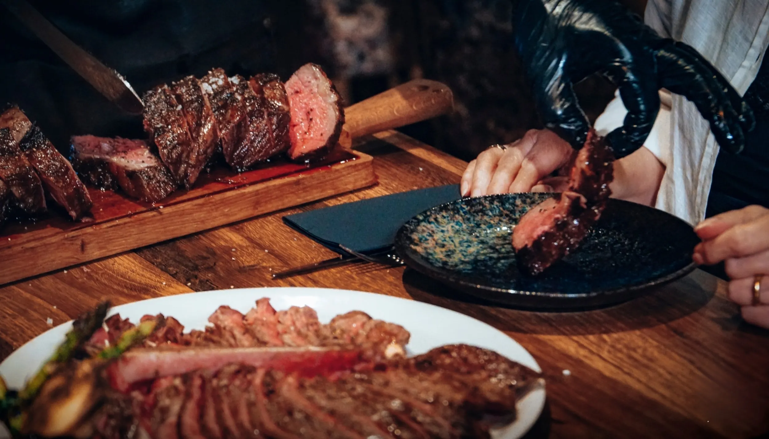 A slice of meat is placed on a plate