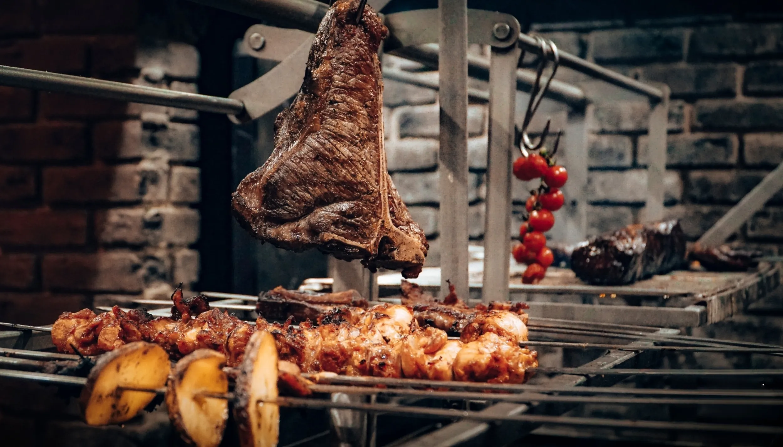 A piece of meat hanging over the grill